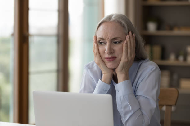 istock Frustrated unhappy senior business woman annoyed with bad computer work 1397545767