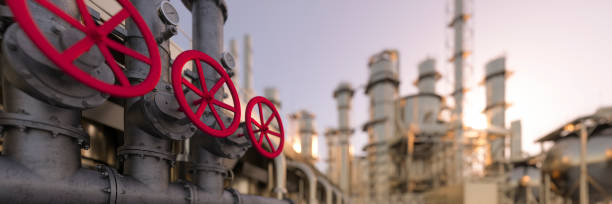 istock Oil pipeline red valves at a refinery 3d render 1397546022