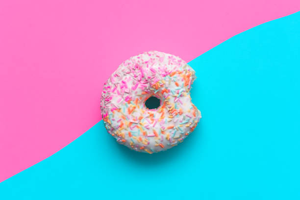 istock Sugar donut split into half portion to reduce unhealthy food quantities 1397546056