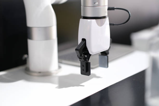 istock Mechanical white arm robotic arm in production 1397547908