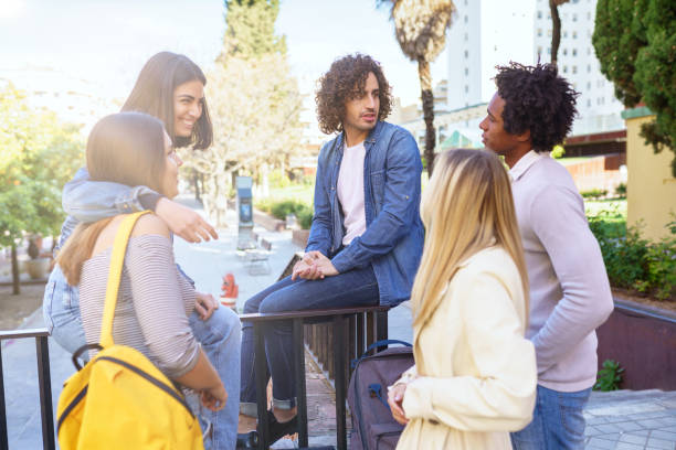 istock Multi-ethnic group of students talking in the street 1397548446