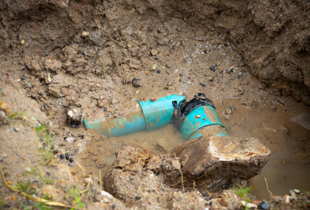istock plumbing broken plastic pipe in the hole and water in wait repair 1397548994