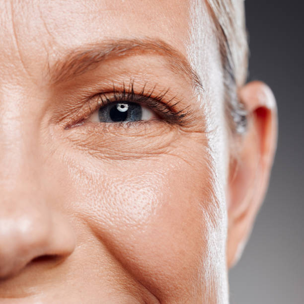 istock Beautiful mature woman posing in studio against a grey background 1397549112