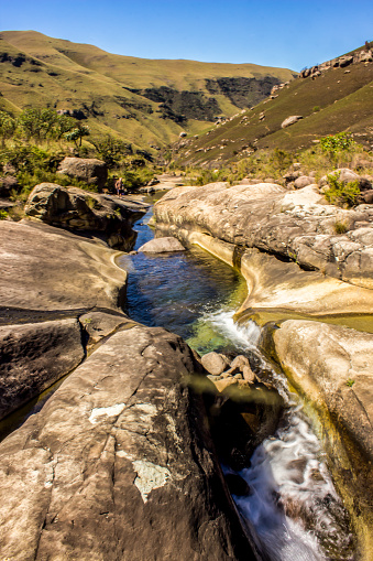 This is the Old Woman Stream in a section named Marble Baths, named so after the smoothly weathered sandstone outcrop over which it flows. The Drakensberg Mountains National Park were declared a UNESCO World Heritage site in 2000 to protect the natural habitats, but also due to its cultural significant since it has the largest concentration of rock paintings in Sub Sahara Africa.