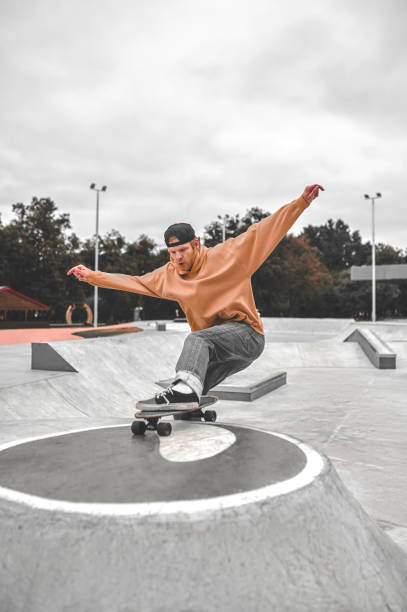 istock Guy on skateboard riding on pedestal in skatepark 1397554317