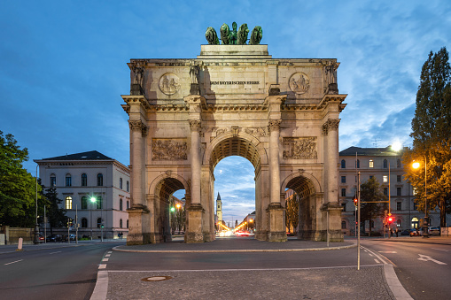 low angle view llluminated Victory Gate in Munich at blue hour