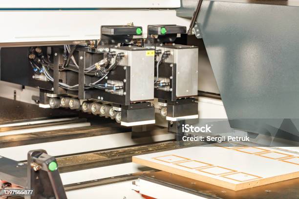 A Fragment Of The Production Of Cabinet Furniture From Chipboard On An Automated Woodworking Line Stock Photo - Download Image Now