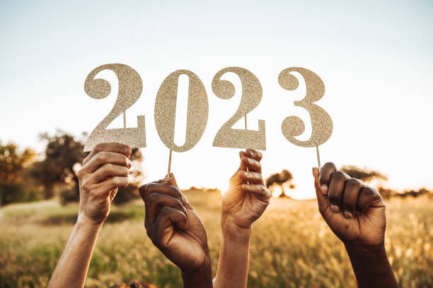 Celebrating the end of the year! Group of friends celebrating together the end of 2022 and the new beginning in 2023. 2023 stock pictures, royalty-free photos & images