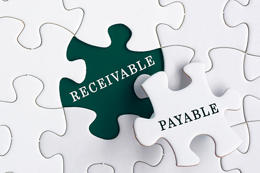 Receivable and payable text on Jigsaw Puzzle. Accounting and business concept