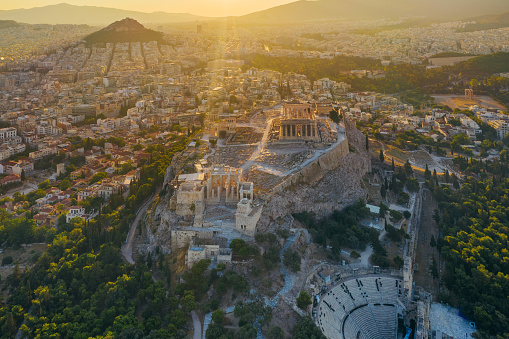 Aerial drone bird's eye view photo of iconic Acropolis hill, the Parthenon and famous theater of Dionysus, Athens historic center, Attica, Greece