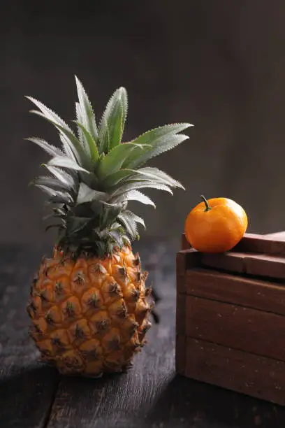 The pineapple or Ananas comosus is a tropical plant with an edible fruit, it is the most economically significant plant in the family Bromeliaceae.