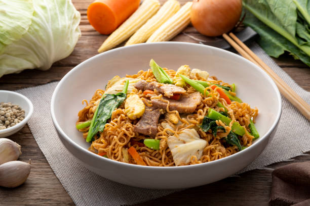 Stir Fried Instant Noodle with pork egg and mixed vegetable