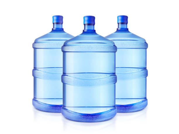 big bottles of water isolated on a white background big bottles of water isolated on a white background water cooler stock pictures, royalty-free photos & images