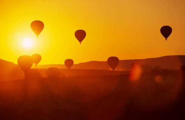 hot air balloons in the sky before launching in mountain cappadocia turkey - cappadocia hot air balloon turkey basket imagens e fotografias de stock