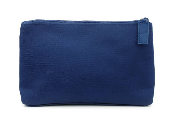 Side view of blue toiletry bag Side view of blue toiletry bag isolated on white clutch bag stock pictures, royalty-free photos & images