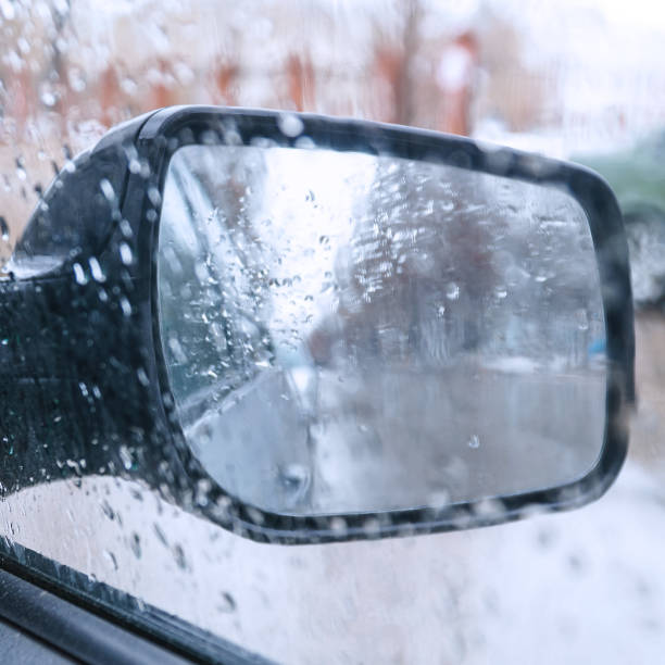 istock View of the rear view mirror on a rainy day from inside the car 1397565722