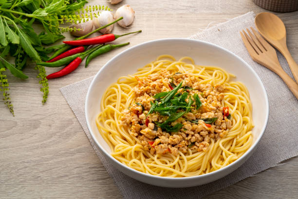 istock Spaghetti topped with stir fried minced chicken and basil 1397565781
