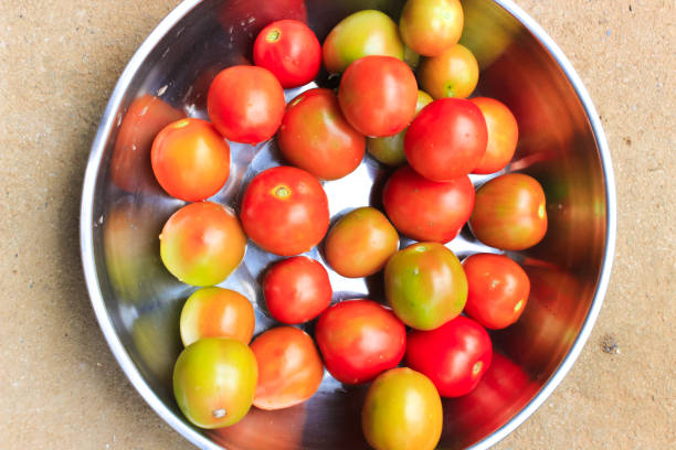 Fresh red tomatoes on container