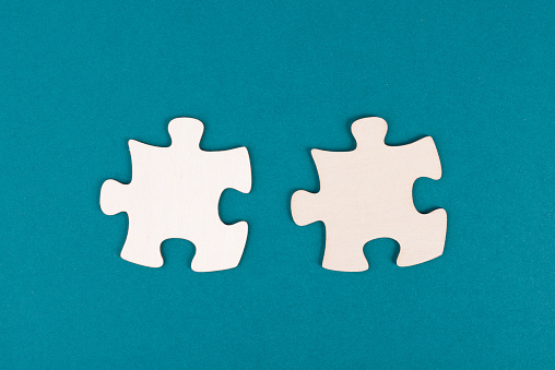 A row of jigsaw pieces on blue background.