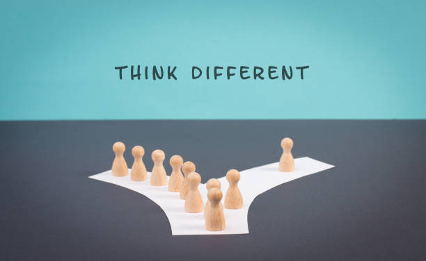 istock Think different stands on the blue background, one nonconformist is standing out from the crowd, creative and visionary concept, mass follows the group 1397566151