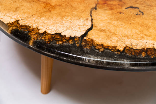 istock Closeup of epoxy resin round table edge on white background 1397567362
