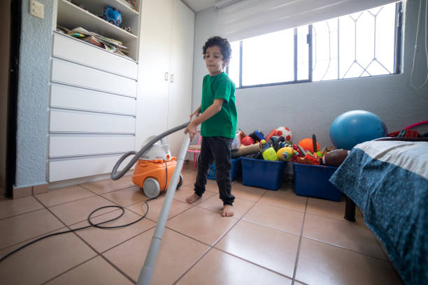 istock children vacuuming their room 1397567543