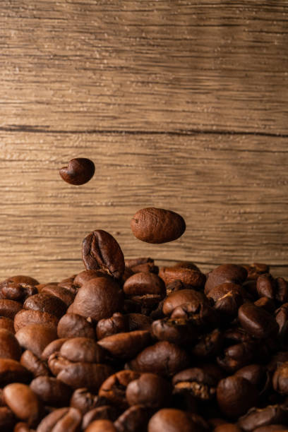 istock Coffee beans close-up wooden background 1397569186