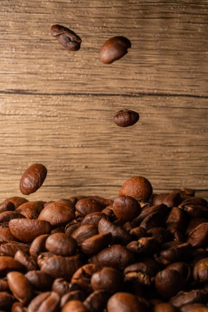 istock Coffee beans close-up wooden background 1397569195