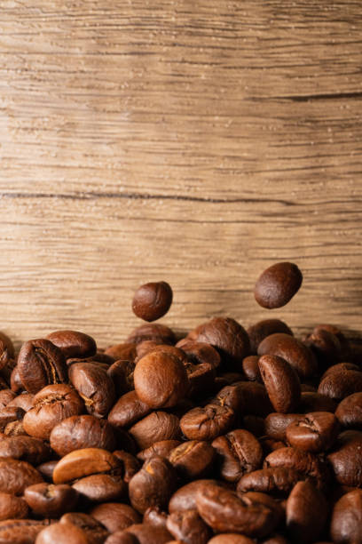istock Coffee beans close-up wooden background 1397569851