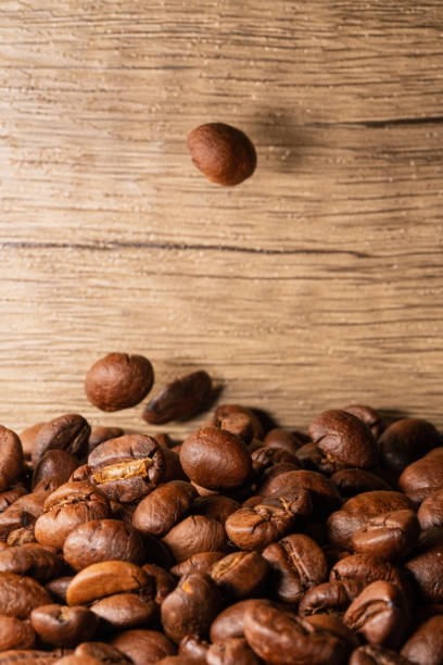 istock Coffee beans close-up wooden background 1397569860