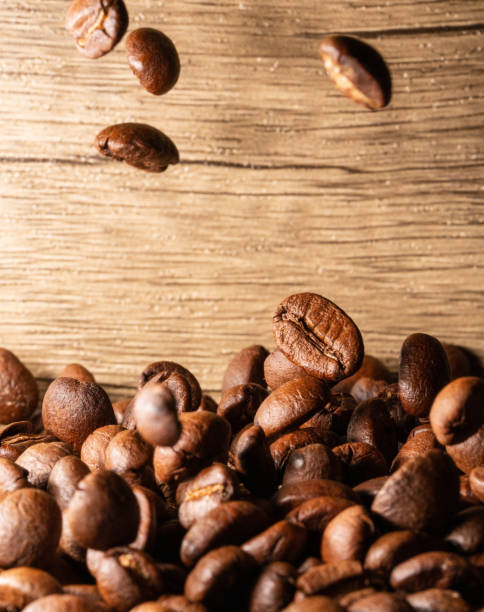 istock Coffee beans close-up wooden background 1397569865