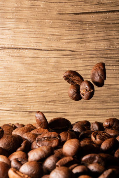 istock Coffee beans close-up wooden background 1397569867