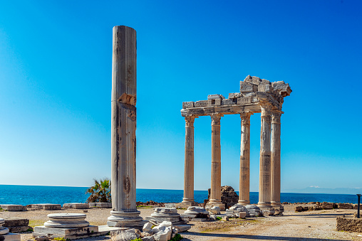 The Temple of Apollo is located at the end of Side's peninsula. Side is a city on the southern Mediterranean coast of Turkey. It includes the modern resort town and the ruins of the ancient city of Side, one of the best-known classical sites in the country.