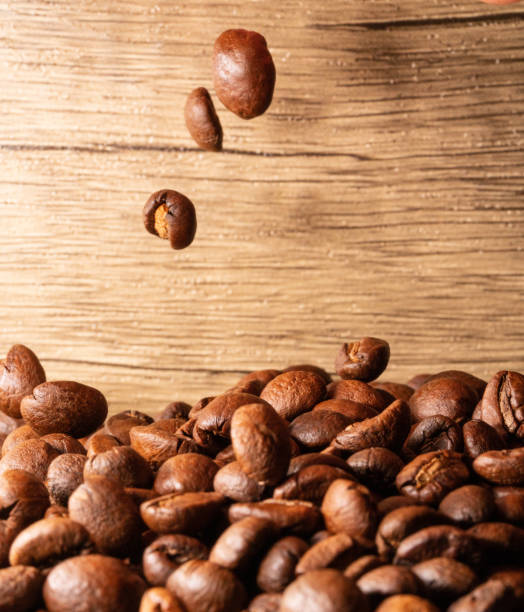 istock Coffee beans close-up wooden background 1397569931