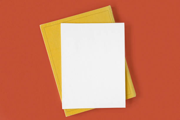 istock Blank canvas sheet with pen on red orange background, office supplies on table. Top view, flat lay, copy space. Net white page. Card mockup. Elegant layout, template. Soft shadow. Minimal design. 1397570281