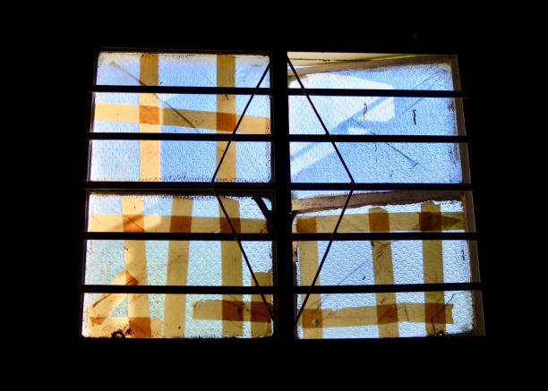 Taped Broken Window stock photo