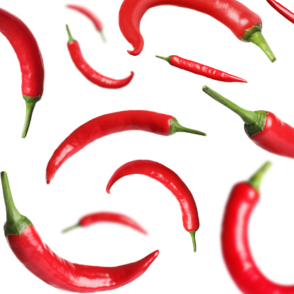 Table top view of red chili peppers in a basket with copy space