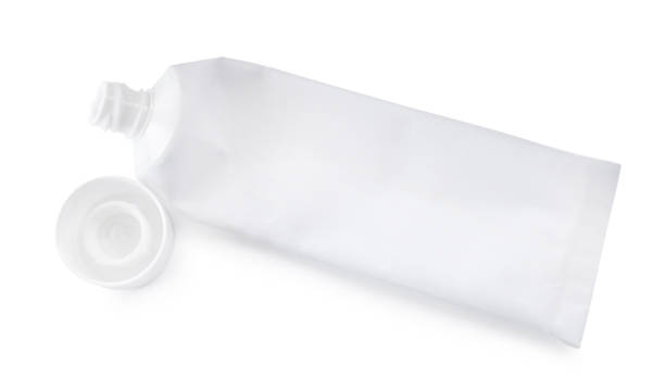 istock Blank tube of toothpaste on white background, top view 1397573014