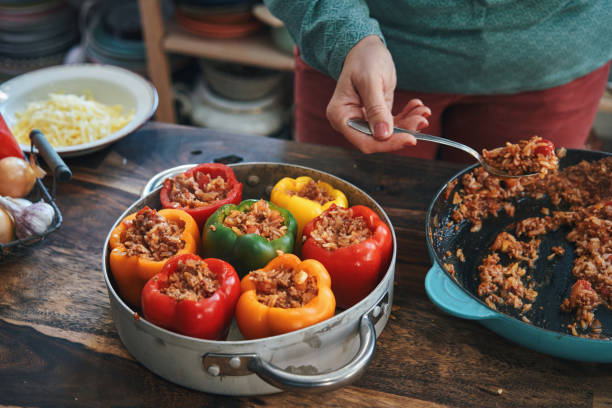 istock Preparing Stuffed Bell Peppers with Ground Meat in Tomato Sauce 1397574263