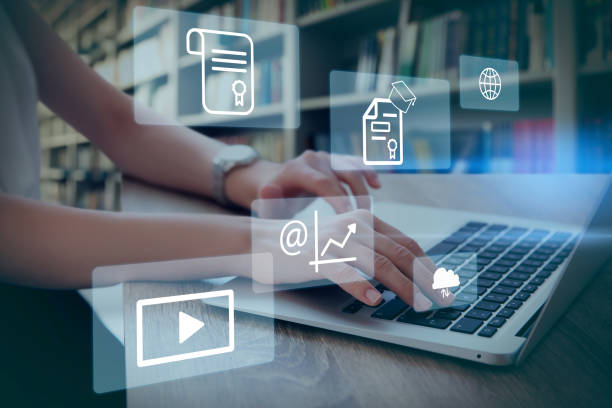 istock Student using laptop in library and illustration of virtual icons. Educational technology 1397574555