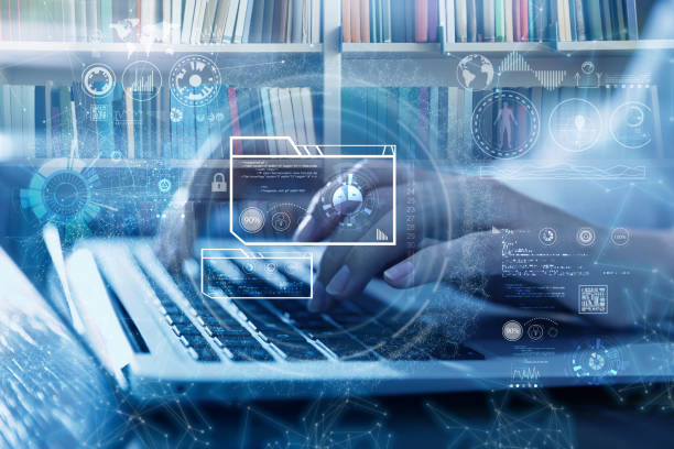 istock Student using laptop in library and illustration of virtual icons. Educational technology 1397574572
