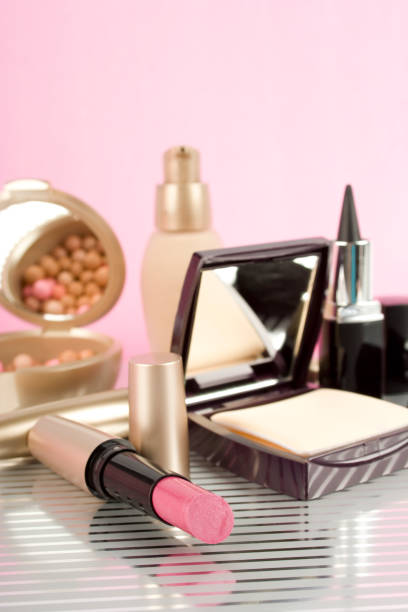 Lots of decorative cosmetics mascara, powder, foundation, cosmetic bag
