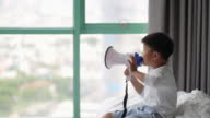 istock Asian boy play a megaphone. Concept of leadership 1397582792