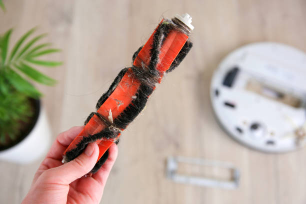 istock A dirty brush for a robot vacuum cleaner. 1397586293
