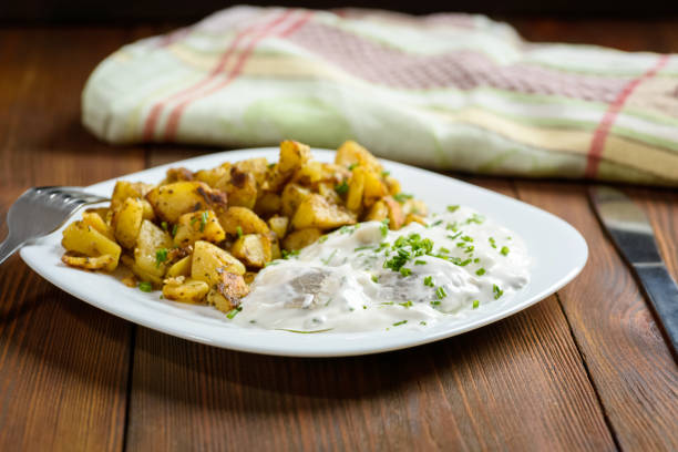 herring in cream served with fried potatoes