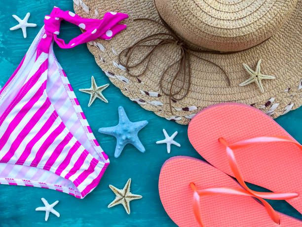 istock Bikini bottom, straw hat, pair of flip-flops and seafish 1397587384