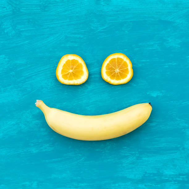 istock Two orange slices and banana 1397587513