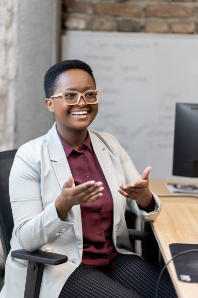 istock Smiling young businesswoman at work 1397588386