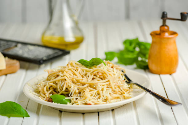 pasta with pepper, bacon and cheese pasta with pepper and bacon sprinkled with grated cheese salt pepper ingredient black peppercorn stock pictures, royalty-free photos & images