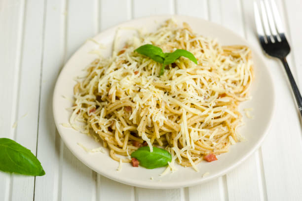 pasta with pepper, bacon and cheese pasta with pepper and bacon sprinkled with grated cheese salt pepper ingredient black peppercorn stock pictures, royalty-free photos & images